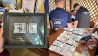 Кафе, офіси та мільйони готівкою: посадовця міграційної служби викрили на приховуванні статків